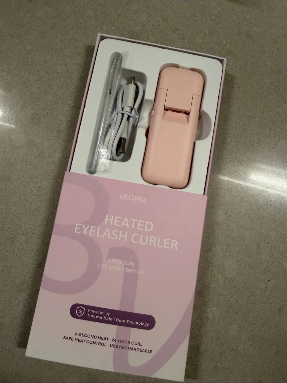 Heated eyelash curler